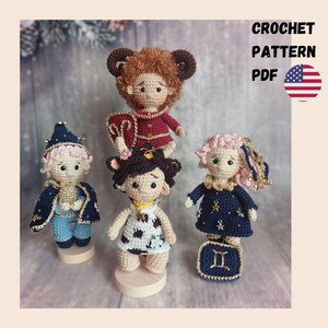 May include: A collection of five handmade crochet dolls, each representing a zodiac sign. The dolls feature detailed outfits in various colors, including blue, red, and white. The image includes the text "CROCHET PATTERN PDF" and a US flag.