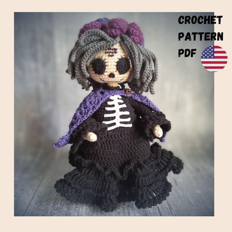 May include: A handmade crochet doll with a skeleton design on a black dress, gray hair, and a purple shawl. The doll has large black eyes and a small pumpkin button. Text on the image reads "CROCHET PATTERN PDF" with a US flag.