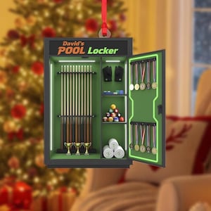 May include: A Christmas ornament shaped like a pool locker, with the text "David's Pool Locker" on top. The locker is open, revealing pool cues, balls, gloves, trophies, and medals. The ornament is hanging from a red ribbon.