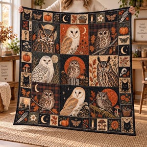 May include: A rectangular quilt featuring a grid of nine central panels depicting various owl species, including barn owls and great horned owls, surrounded by a border of pumpkins, black cats, moons, candles, and floral motifs in autumn colors.