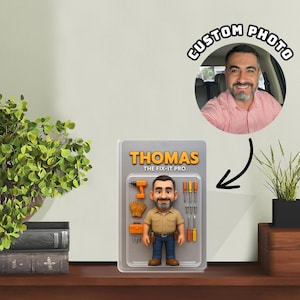 May include: A custom action figure in blister packaging featuring a bearded man wearing a tan shirt and blue jeans. The packaging is labelled THOMAS THE FIX-IT PRO and includes miniature accessories like a drill, gloves, toolbox, and screwdrivers.