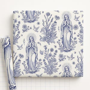 May include: A roll of cream-colored wrapping paper with a blue floral and religious illustration. The design features images of the Virgin Mary, flowers, butterflies, and doves. The paper is suitable for gifts.