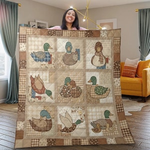 May include: A patchwork quilt featuring nine squares, each showcasing a different duck design. The ducks are depicted in various poses and outfits, with a color palette of browns, greens, and blues. The quilt has a checkered border.
