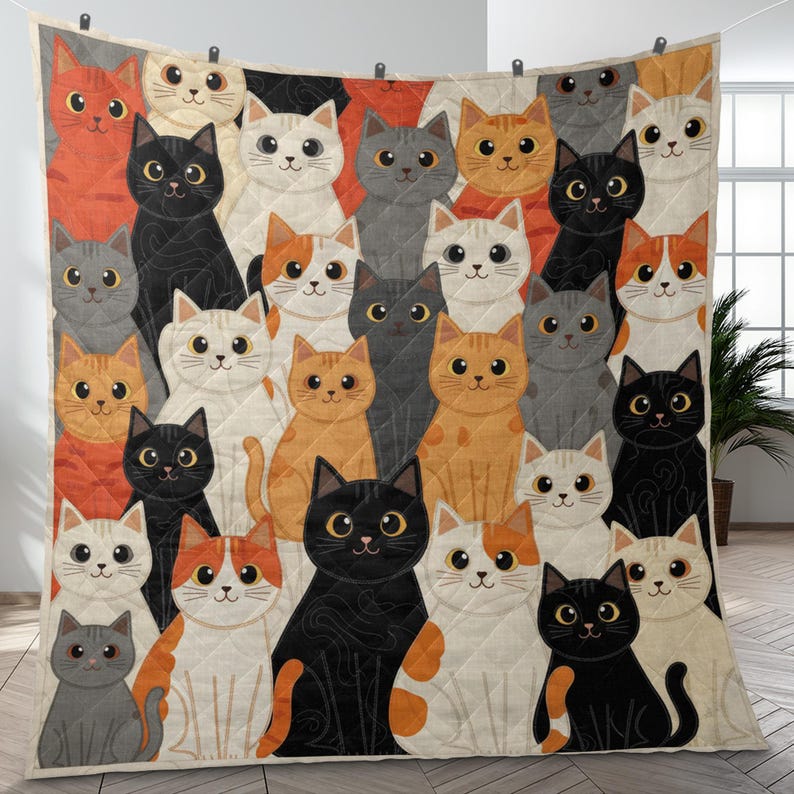 May include: A quilted throw blanket featuring a repeating pattern of cartoon cats in various colors including black, white, orange, and gray. The cats have large eyes and are arranged in a dense grid across the entire surface of the fabric.