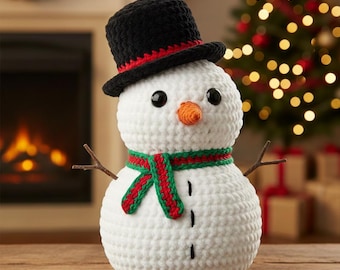 May include: A handmade crochet snowman with a black top hat, orange carrot nose, and twig arms. The snowman wears a red and green scarf. Black button eyes and a stitched mouth complete the festive winter decoration.