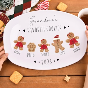 May include: White oval serving platter with the text "Grandma's Favorite Cookies" and gingerbread cookie illustrations. The names Grace, Bella, Molly, York, and Sigrid are printed below the gingerbread figures. The year 2025 is also printed on the platter.