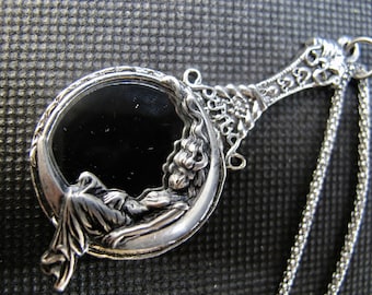 Moon Goddess sitting on a  Looking Glass Necklace  in Antique Silver with a Stainless Steel  24 inch Rolo chain