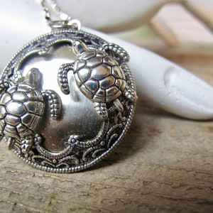 Silver Baby SeaTurtles Locket  Necklace in  Silver-tone with a Stainless Steel 24 inch Rolo chain - SeaLife