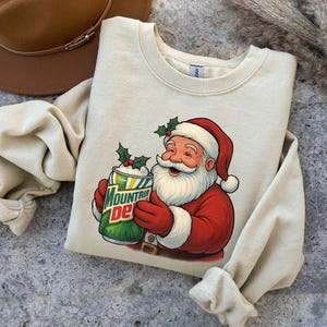 Christmas Mountain Dew Santa Shirt, Mtn Dew Crewneck, Soda Lover Hoodie, Mountain Dew Logo Sweatshirt, Gift for Mtn Dew Lover, a236