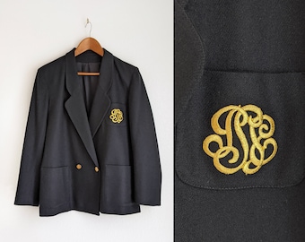 Blazer de lana vintage: chaqueta negra con emblema bordado, talla 6
