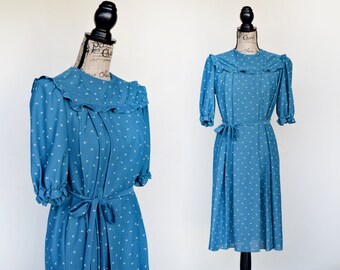 Jaren 80 vintage blauwgroene jurk met grafische print, geplooide kraag, medium