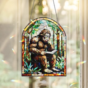 Funny Bigfoot Hologram Window Hanging – Holographic Acrylic Sasquatch Reading Book, Nerdy Cryptid Decor, Forest Gift for Readers