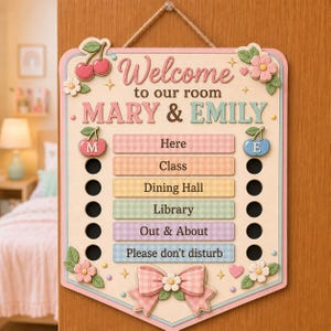 May include: A rectangular wooden door sign with a light cream background, featuring the text Welcome to our room MARY & EMILY. It includes six horizontal pastel-colored bars labeled Here, Class, Dining Hall, Library, Out & About, and Please don't disturb, with circular cutouts on both sides and decorative cherry and flower accents.