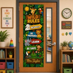 May include: A vertical door banner featuring a jungle theme with the text WILD RULES, RESPECT, BE PREPARED, LEARN, BE SAFE, and Mrs. Taylor. The design includes illustrations of a giraffe, sheep, lion, elephant, monkey, toucan, and parrot.