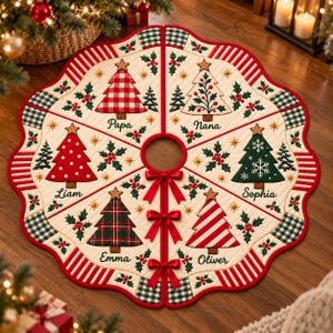 May include: A circular quilted Christmas tree skirt with a scalloped edge, featuring six segments decorated with embroidered trees, holly, and the names Papa, Nana, Sophia, Oliver, Emma, and Liam. The center opening is secured by three red ribbons.