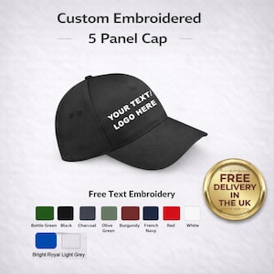 May include: A black 5-panel cap with the text "YOUR TEXT/LOGO HERE" embroidered on the front. The image shows color options for the embroidery, including bottle green, black, charcoal, olive green, burgundy, French navy, red, white, and bright royal light grey.