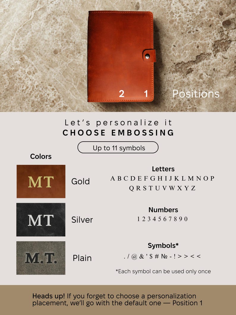 May include: A brown leather journal with two personalization options. The journal has a gold, silver, or plain embossed option. The text on the image reads "Let's personalize it CHOOSE EMBOSSING Up to 11 symbols Letters A B C D E F G H I J K L M N O P Q R S T U V W X Y Z Numbers 1 2 3 4 5 6 7 8 9 0 Symbols* . / @ & ' $ # № - ! >> << *Each symbol can be used only once Heads up! If you forget to choose a personalization placement, we'll go with the default one - Position 1"