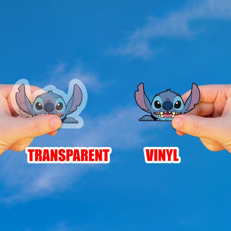 May include: Two Stitch character stickers, one transparent and one vinyl, held against a blue sky. The transparent sticker is on the left, and the vinyl sticker is on the right. The word "TRANSPARENT" is below the transparent sticker, and the word "VINYL" is below the vinyl sticker.
