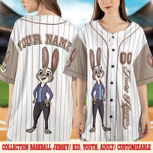 May include: White baseball jersey with vertical pinstripes, featuring a cartoon character and the name "Judy Hopps." The jersey has brown sleeves and trim, with the text "YOUR NAME" on the back. The jersey is customizable and available for kids, youth, and adults.