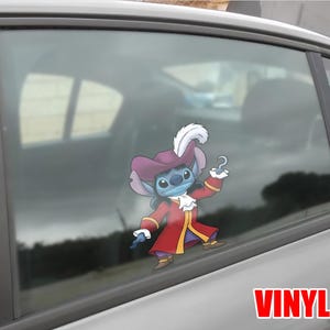 May include: A vinyl decal of Stitch dressed as Captain Hook, with a red coat, purple hat, and a hook. The decal is applied to a car window. The word "VINYL" is printed in red.