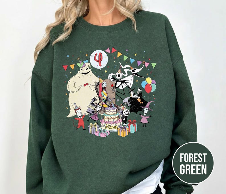 May include: Forest green sweatshirt featuring a colorful graphic of characters from The Nightmare Before Christmas celebrating a birthday. The design includes a birthday cake, presents, and the number 4.