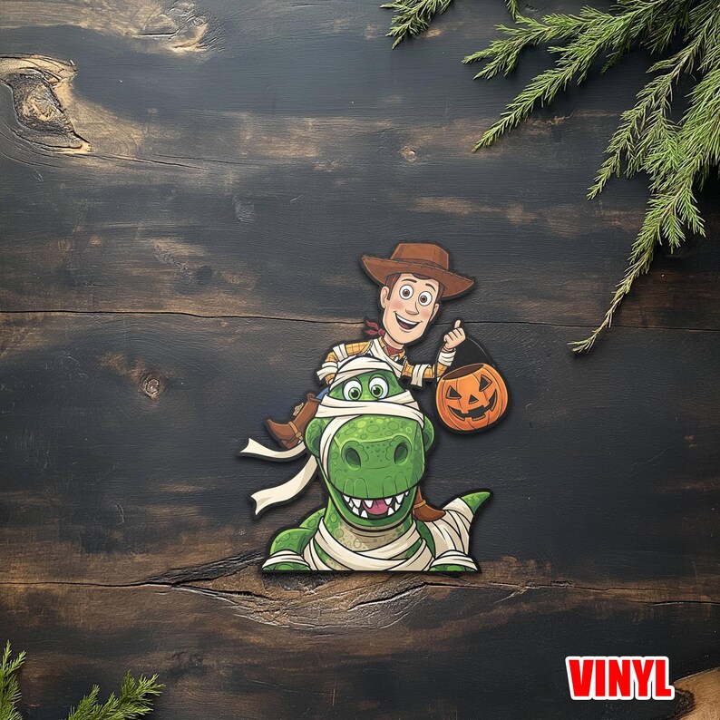 May include: A Halloween-themed vinyl sticker featuring Woody from Toy Story riding a green dinosaur wrapped in bandages. Woody holds a jack-o'-lantern. The word "VINYL" is in a red box at the bottom.