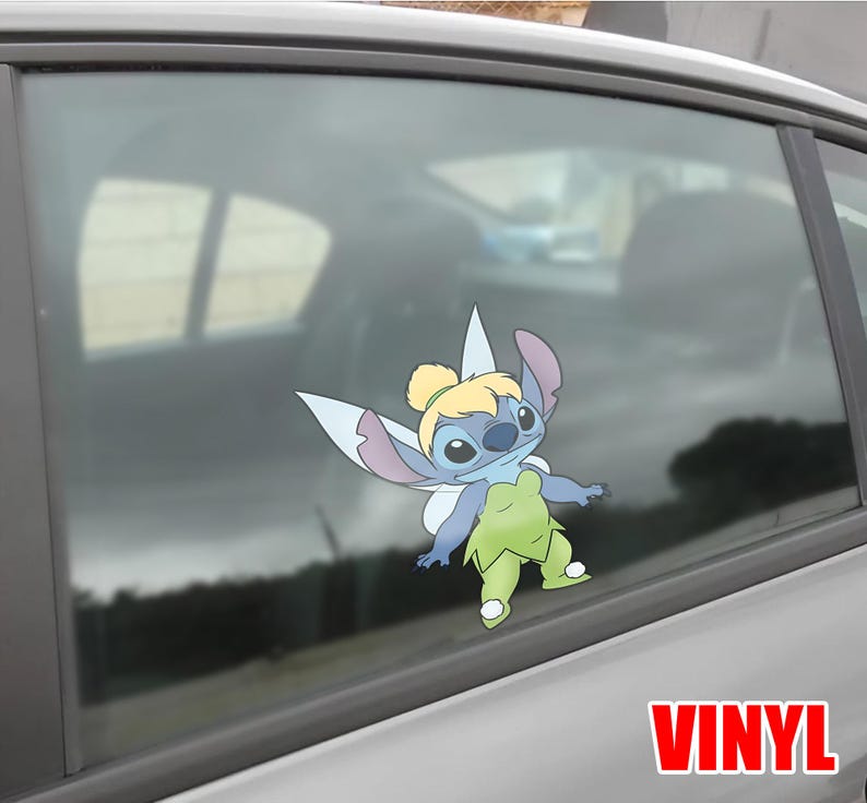 May include: A colorful vinyl decal of Stitch dressed as Tinkerbell, with blue, green, and purple hues. The decal is affixed to a car window. The word "VINYL" is printed in red at the bottom right.