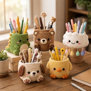 May include: A collection of handmade crochet pen holders in various animal designs, including a green dinosaur, a brown bear, a white cloud, a beige dog, and a yellow chick. Each holder is filled with pens and pencils, perfect for desk organization.