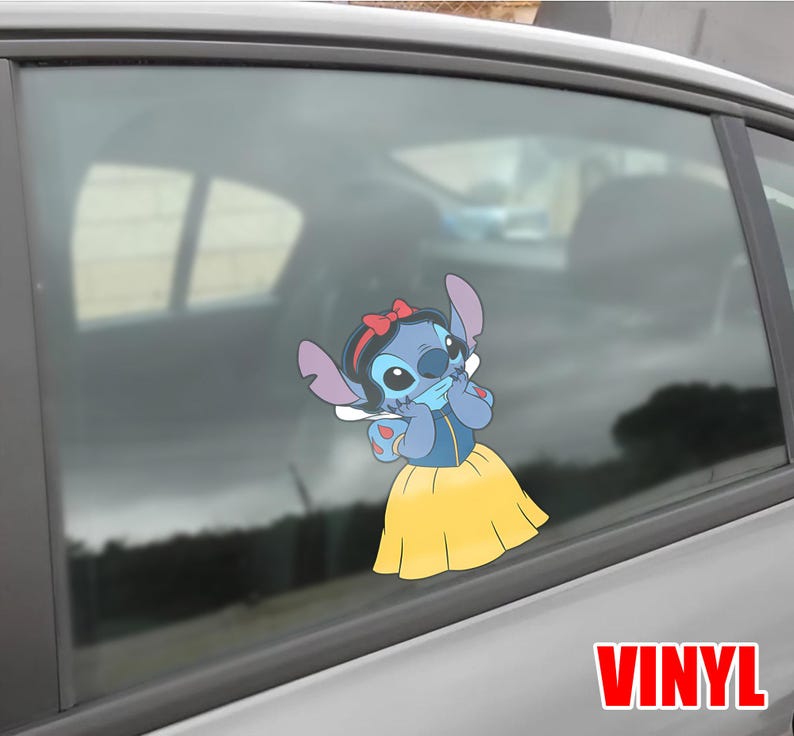 May include: A blue vinyl decal of Stitch dressed as Snow White, with a red bow, blue dress, and yellow skirt. The decal is applied to a car window. The word "VINYL" is printed in red.