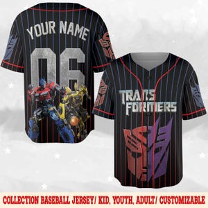 May include: Black baseball jersey with blue and red pinstripes. The front features the text "TRANSFORMERS" and a red and purple logo. The back has the text "YOUR NAME" above the number "06" and a graphic of Optimus Prime and Bumblebee.