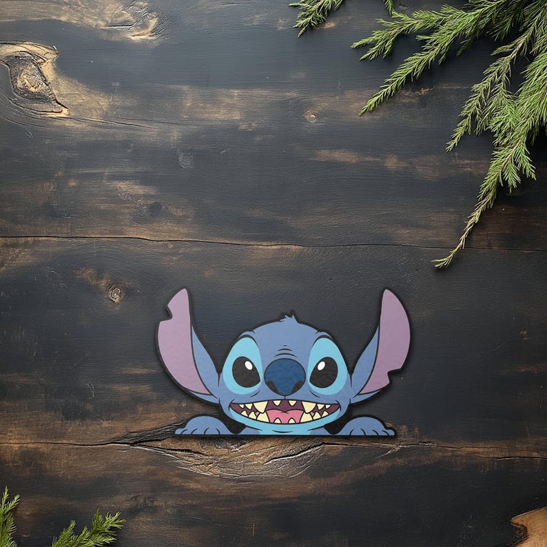 May include: A blue cartoon character with large ears and a wide grin. The character's face is blue with large black eyes and a pink mouth. The image is set against a dark wood background with green foliage.