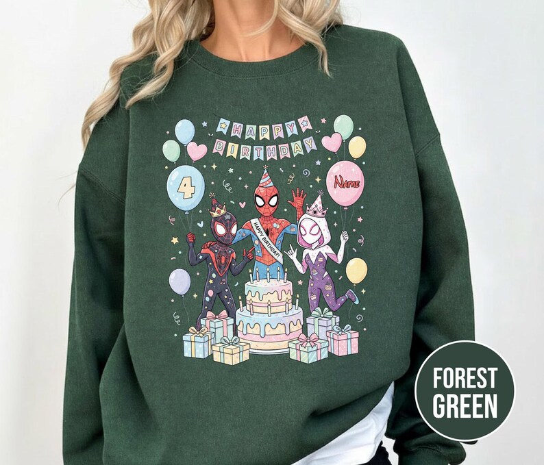 May include: Forest green sweatshirt featuring a colorful birthday graphic with Spider-Man characters. The design includes a cake, balloons, and the text "Happy Birthday." The number "4" is on a balloon. The sweatshirt is a comfortable, casual style.