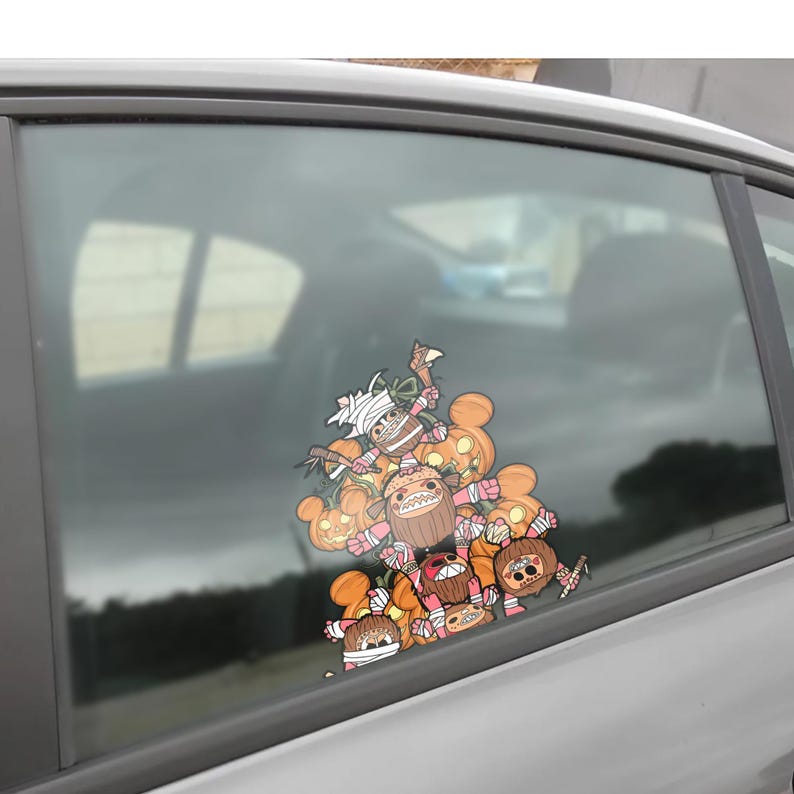 May include: A colorful car window decal featuring a collection of cartoon characters with pumpkin heads and wrapped in bandages. The characters are in shades of orange, brown, and pink, with some holding small weapons.