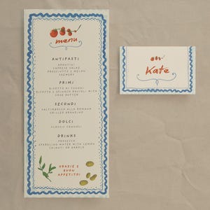 May include: A menu and place card set with a cream background and blue wavy borders. The menu features the word "menu" and a list of Italian dishes. The place card has the name "Kate" written on it.