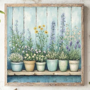 May include: A framed painting depicts a row of potted plants with colorful flowers against a light blue wooden background. The pots are in shades of blue, beige, and green. The artwork evokes a serene, garden-like atmosphere.
