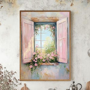 Puede incluir: Pintura enmarcada de una ventana abierta con contraventanas rosas. La ventana revela un cielo azul brillante y vegetación, con flores rosas en un alféizar. La obra de arte tiene un estilo texturizado e impresionista.