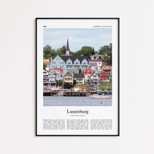 May include: A framed print featuring a colorful coastal town with a church steeple. The image includes the text "Lunenburg, Nova Scotia, Canada" and coordinates. The town's buildings are painted in various colors, with boats docked in the water.