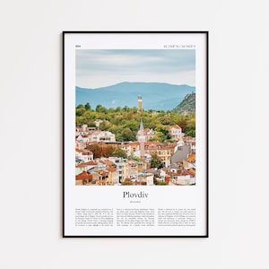 May include: A framed print featuring a scenic view of Plovdiv, Bulgaria. The image showcases a cityscape with red-tiled roofs, a mosque, and a distant mountain range under a blue sky. Text at the bottom reads "Plovdiv, Bulgaria."