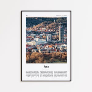 May include: A framed print featuring a scenic view of Jena, Germany, with a tall, cylindrical building dominating the skyline. The image captures a cityscape with buildings, trees, and a mountain backdrop, with the city's name and coordinates at the top.