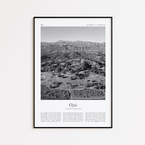 May include: Black and white framed print featuring an aerial view of Ojai, California, with mountains in the background. The print includes the text "Ojai" and coordinates, along with a description of the area.