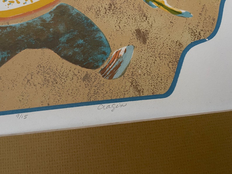 May include: A colorful abstract print with a blue, yellow, and orange design. The print is signed "Craigin" and numbered "9/15".