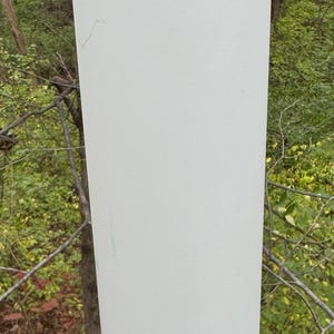 May include: A white cylindrical lampshade with a small hole in the top. The lampshade is made in Finland.