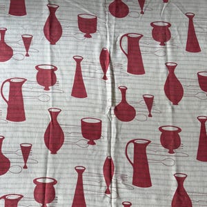 May include: A fabric with a repeating pattern of red stylized kitchenware on a white background with thin gray stripes. The pattern includes pitchers, vases, cups, and glasses.
