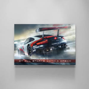 May include: A Porsche race car in motion, captured in a dynamic image. The car features a white, black, and red colour scheme, with "PORSCHE DESIGN" displayed. The image also includes the text "IT ALL STARTS WITH A DREAM".