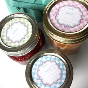 May include: Three glass jars with lids, each with a different coloured gingham patterned label. The labels have a white frame with the words "Date:" and "Contents:" printed on them.