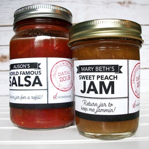 May include: Two glass jars with labels. The jar on the left contains red salsa with a black and white label that reads "Alison's World Famous Salsa" and "Return jar for a refill!" The jar on the right contains peach jam with a black and white label that reads "Mary Beth's Sweet Peach Jam" and "Return jar to keep me jammin!"