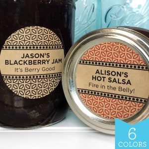 May include: Two round jar labels with a black and white geometric pattern. The label on the left says "Jason's Blackberry Jam It's Berry Good". The label on the right says "Alison's Hot Salsa Fire in the Belly!"