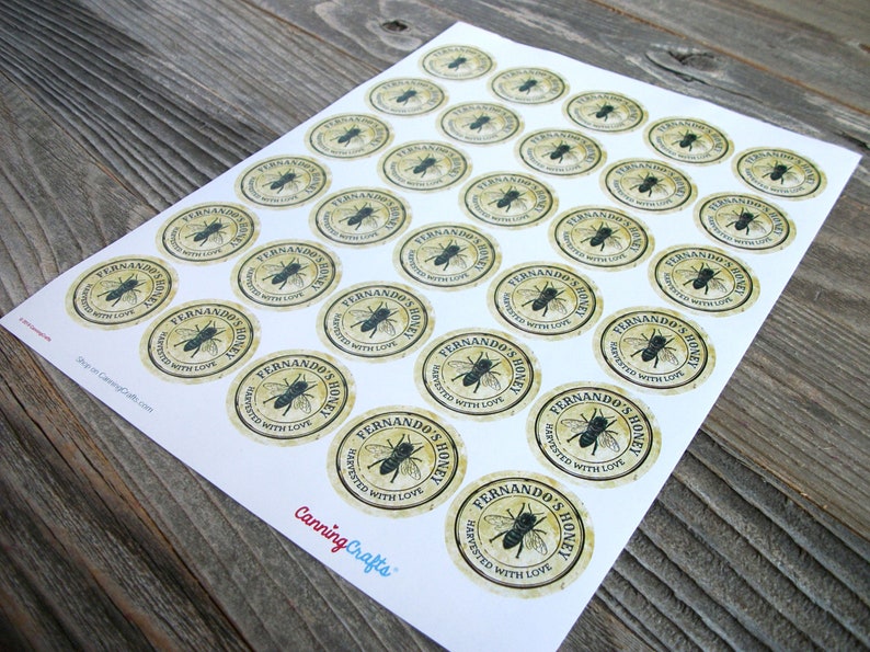May include: A sheet of 24 round honey jar labels with a vintage design. The labels are beige with a black bee illustration and the text "Fernando's Honey Harvested with Love".