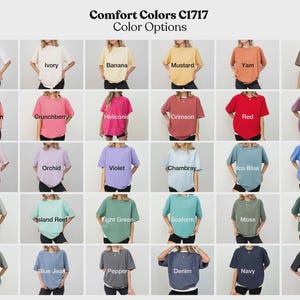 May include: A chart displaying 36 different colour options for Comfort Colors C1717 t-shirts. The colours are arranged in six rows of six colours each. The colours include white, ivory, banana, mustard, yam, espresso, watermelon, crunchberry, heliconia, crimson, red, berry, blossom, orchid, violet, chambray, ice blue, fio blue, bay, island reef, light green, seaform, moss, blue spruce, grey, blue jean, pepper, denim, navy, and black.