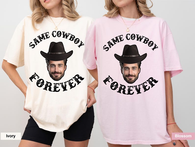 May include: Two t-shirts with the text "Same Cowboy Forever" and a cartoon cowboy wearing a hat. The t-shirt on the left is ivory and the t-shirt on the right is pink.
